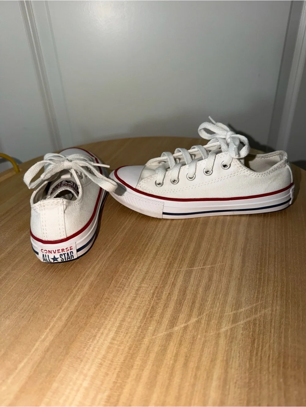 Converse Low Top Canvas Sneakers in White with Red Trim